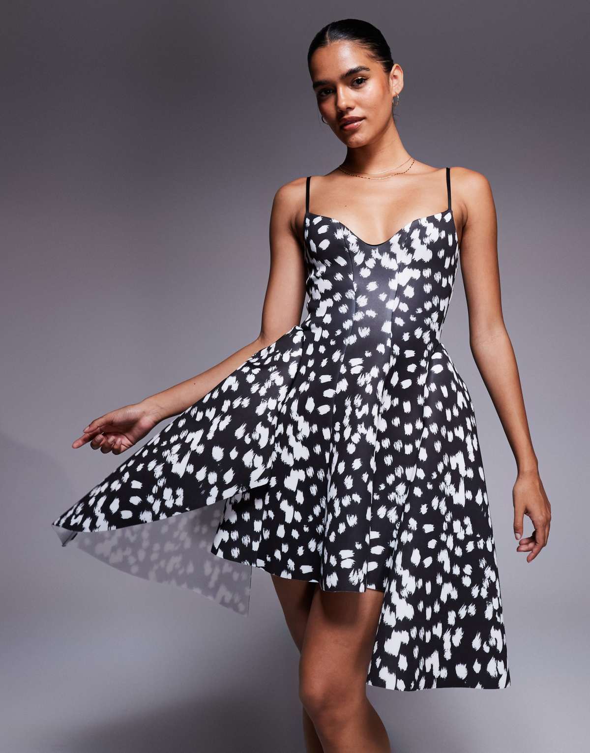 ASOS DESIGN mini dress with full hem sweep and asymmetric hem detailing in spot print