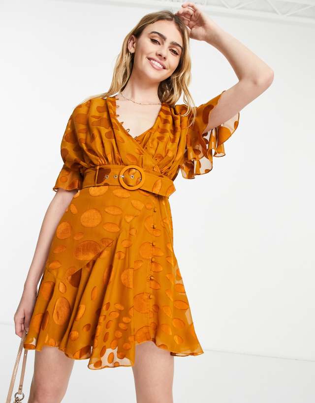 ASOS DESIGN mini dress with rouleaux details and belt in rust warped dot