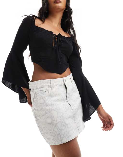 ASOS DESIGN - Mini-jupe en jean à imprimé serpent