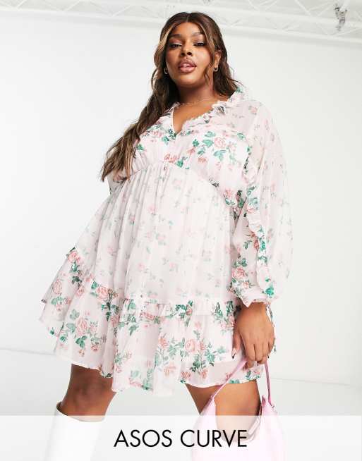 ASOS DESIGN - Mini skaterjurk met V-vormige voor- en achterkant, ruches en bloemenprint in roze