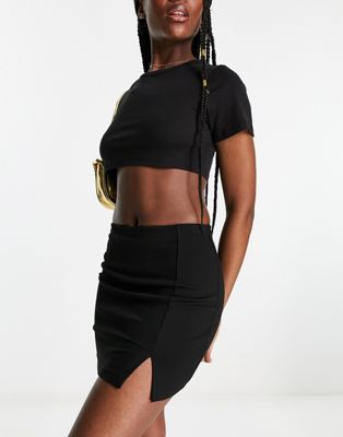 ASOS DESIGN mini skirt with split hem in black
