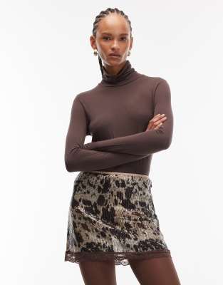 ASOS DESIGN - Mini-Skort mit Kuhfleckenmuster und Pailletten-Bunt
