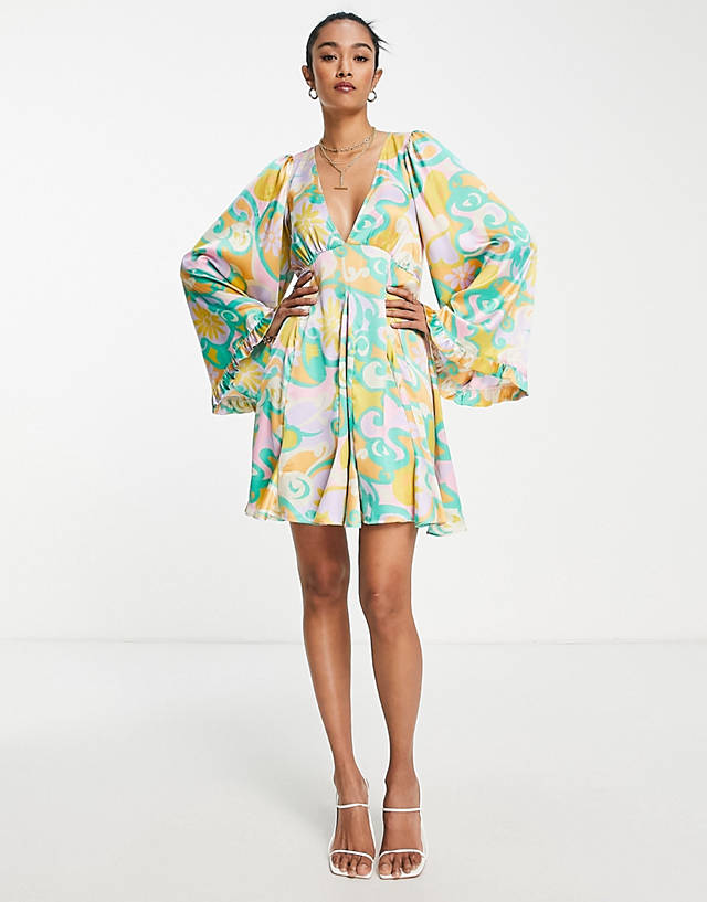 ASOS DESIGN mini smock dress with godets and flared sleeves in bright abstract floral