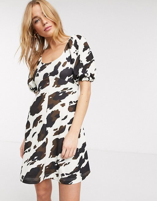 ASOS DESIGN mini swing dress in cow print