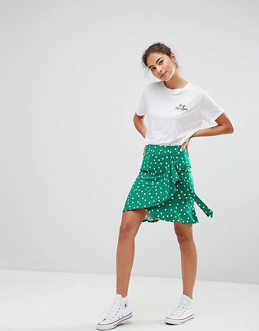 ASOS DESIGN mini wrap skirt in polka dot print