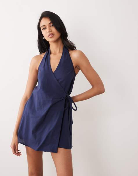 ASOS DESIGN - Mini-zonnejurk van katoen en linnen met halternek en overslag in marineblauw - view 1