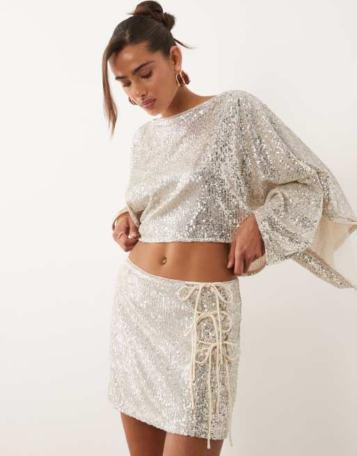 ASOS DESIGN - Minigonna color avorio con paillettes e allacciatura laterale