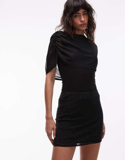 ASOS DESIGN - Minigonna in rete nera con dettagli applicati a caldo