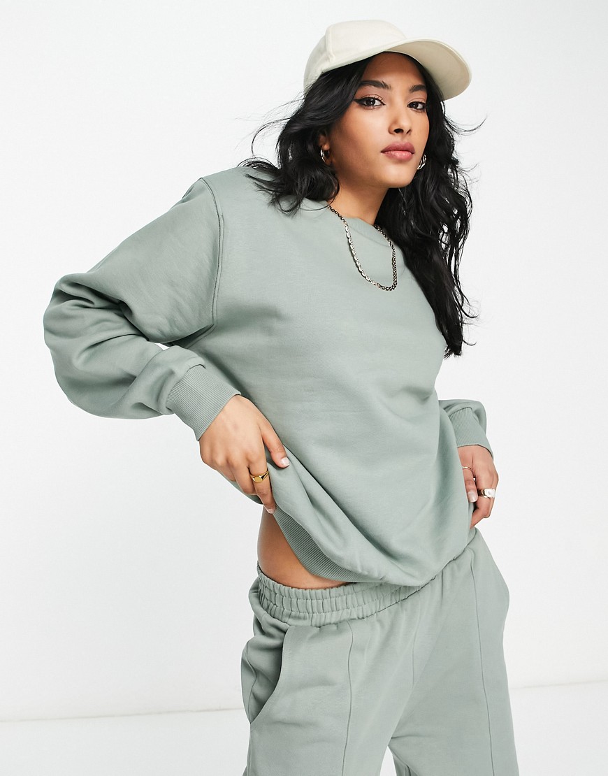 ASOS DESIGN minimal oversized sweatshirt with shoulder pad in moss green