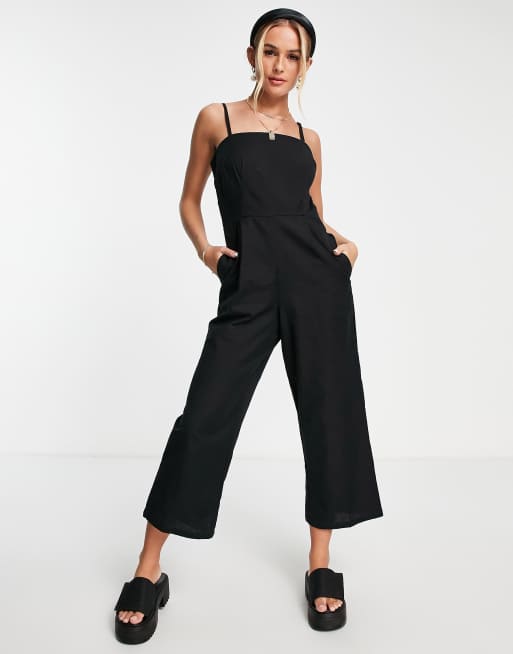 ASOS DESIGN - Minimalistische jumpsuit met knopen en open achterkant in zwart