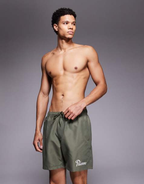 ASOS DESIGN – Mittellange Badeshorts in Khaki mit Stickerei - view 1