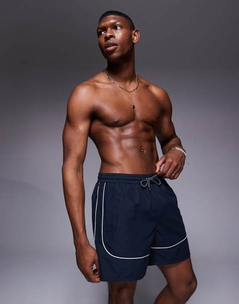 ASOS DESIGN – Mittellange Badeshorts in Marineblau mit kontrastierender Paspelierung in Weiß - view 1