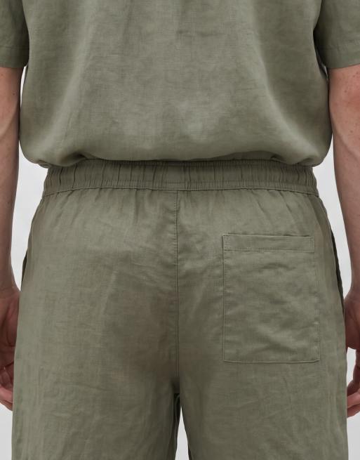 ASOS DESIGN – Mittellange, schmal geschnittene Shorts aus 100% Leinen in Khaki, Kombiteil, 4 von 5