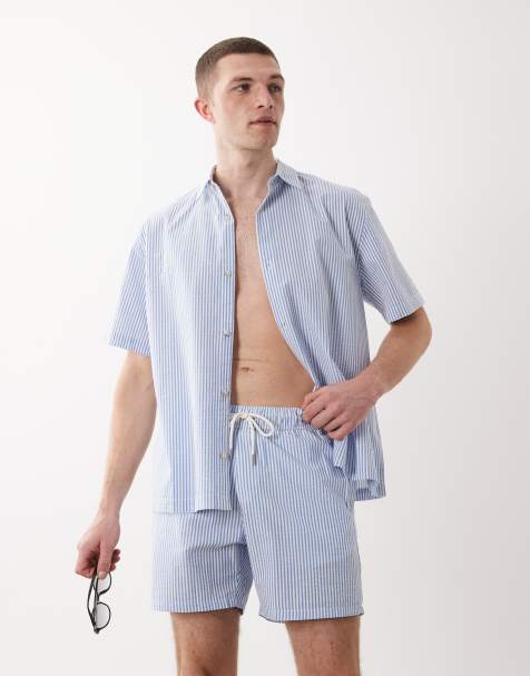 ASOS DESIGN – Mittellange Seersucker-Badeshorts in gestreiftem Blau, Kombiteil - view 1