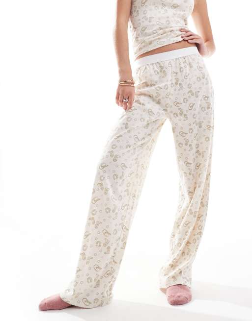 ASOS DESIGN - Mix en match - Pyjamabroek met zichtbare tailleband in rodeoprint