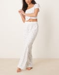 [ASOS DESIGN] ASOS DESIGN Mix & Match pyjama pants with exposed waistband and picot trim in ditsy print-White S Ditsy