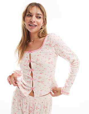 ASOS DESIGN - Mix & Match - Pyjama-Strickjacke aus Pointelle mit Blümchenmuster in Rosa mit Schleifenprint