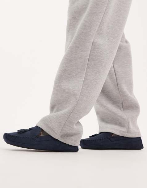 ASOS DESIGN moccasin slippers in navy with faux fur lining with tassel - view 1