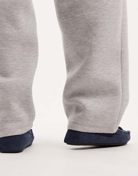 ASOS DESIGN moccasin slippers in navy with faux fur lining with tassel - view 2