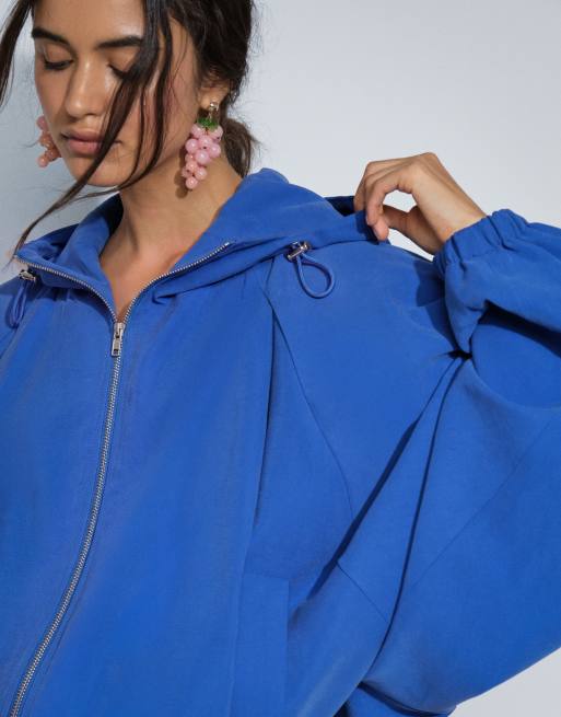 ASOS DESIGN modal hooded zip through sports bomber in blue, 3 of 9