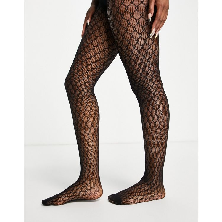 ASOS DESIGN printed tights in monogram