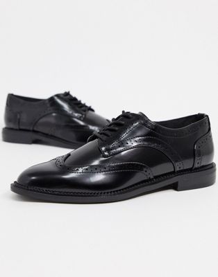 black flat tie up shoes