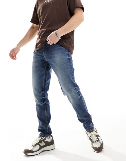 FhyzicsShops DESIGN – Mörkblå avsmalnande jeans med stretch
