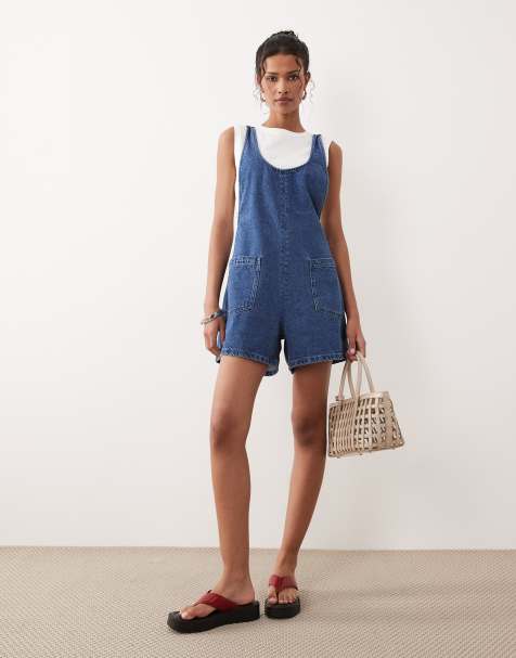 ASOS DESIGN – Mörkblå playsuit i denim med djup halsringning och korsade band baktill - view 1