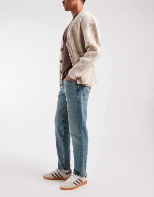 ASOS DESIGN – Mörkblå, tvättade och avsmalnande jeans med tonade detaljer, 2 av 5