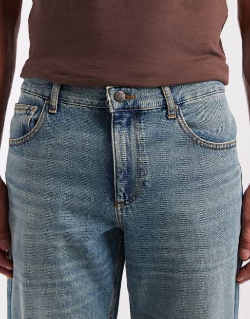 ASOS DESIGN – Mörkblå, tvättade och avsmalnande jeans med tonade detaljer, 4 av 5