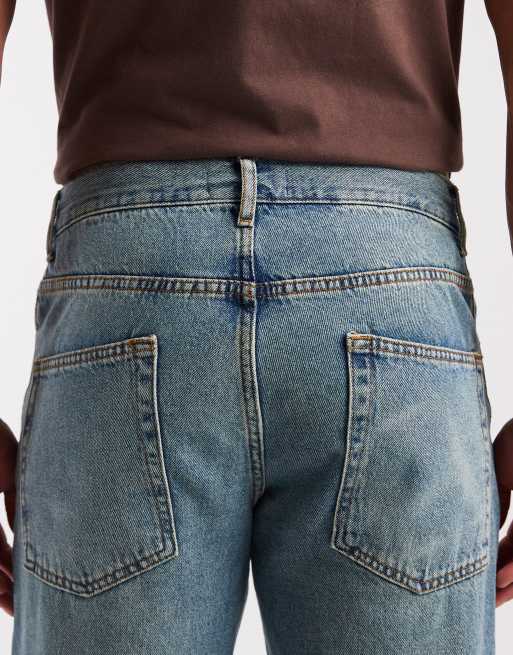 ASOS DESIGN – Mörkblå, tvättade och avsmalnande jeans med tonade detaljer, 5 av 5