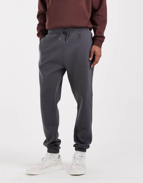 ASOS DESIGN – Mörkgrå, enkla mjukisbyxor med smal passform - view 1