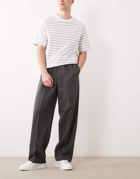ASOS DESIGN – Mörkgrå, figursydda byxor med vida ben och resårmidja - view 1
