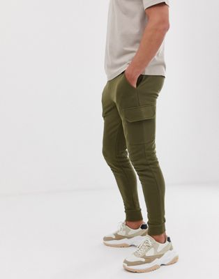 ASOS DESIGN – Mörkt olivgröna joggers med smal passform och cargo-ficka