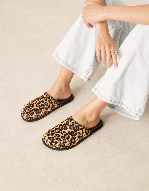 ASOS DESIGN Motion leather flat mules in leopard pony