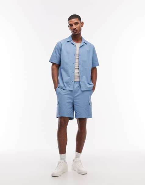 ASOS DESIGN motionMAX™ four way stretch shorter length cargo shorts in blue (part of a set) - view 1