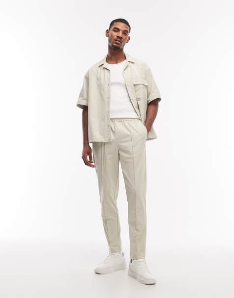 ASOS DESIGN motionMAX™ four way stretch tapered pants in beige with pintucks - part of a set - view 1