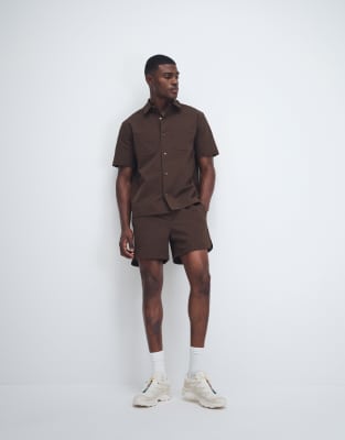 Asos Design Motionmax Shorter Length Shorts With Curved Hem In Brown