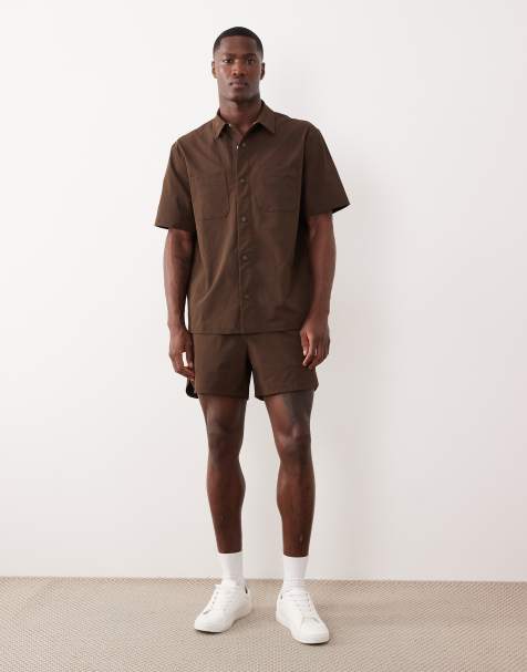 ASOS DESIGN motionMAX shorter length shorts with curved hem in brown - view 1