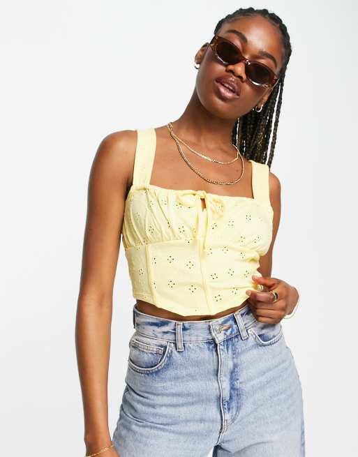 ASOS DESIGN - Mouwloze korsettop met broderie in geel