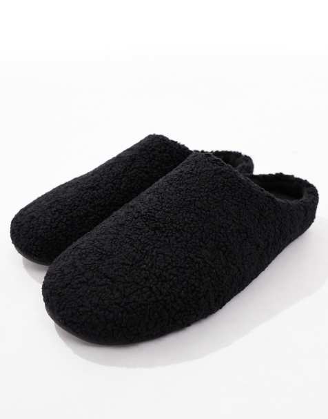 ASOS DESIGN mule slippers in black borg - view 2