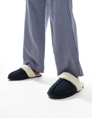 mule slippers in navy suede with faux shearling lining