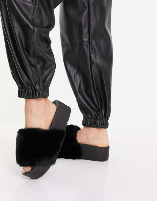 ASOS DESIGN Mules plateformes en fausse fourrure Noir