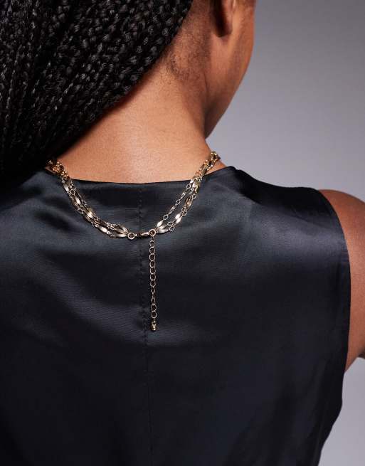 ASOS DESIGN multi layer lariat necklace with celestial detail in gold tone