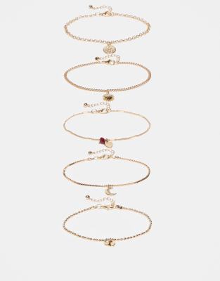 multi-pack bracelets with fine chains and charm drop details in gold tone
