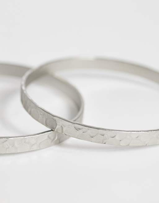 ASOS DESIGN multi-pack of skinny bangles in hammered silver tone, 2 of 3