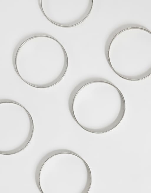 ASOS DESIGN multi-pack of skinny bangles in hammered silver tone, 3 of 3