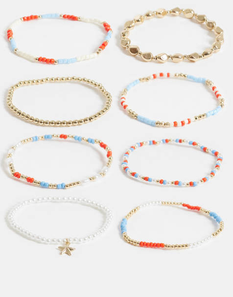 ASOS DESIGN multi-pack of stretch bangles in gold tone and blue - view 1