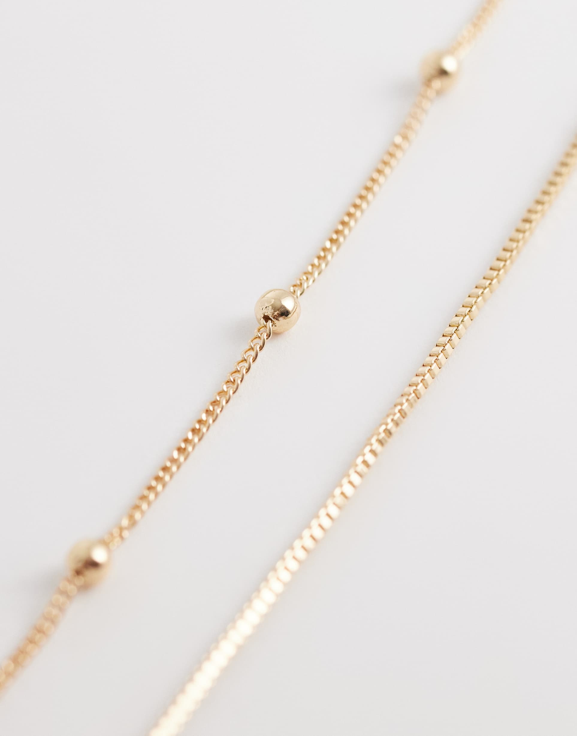 asos design multi-row belly chain with dot-dash detail in gold tone