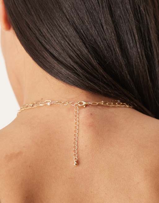 ASOS DESIGN multi row necklace with dot-dash chain and floral details in gold tone